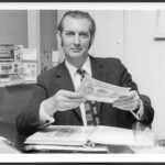 02Colin at his desk at Stanley Gibbons, with a rare British North Borneo Company note